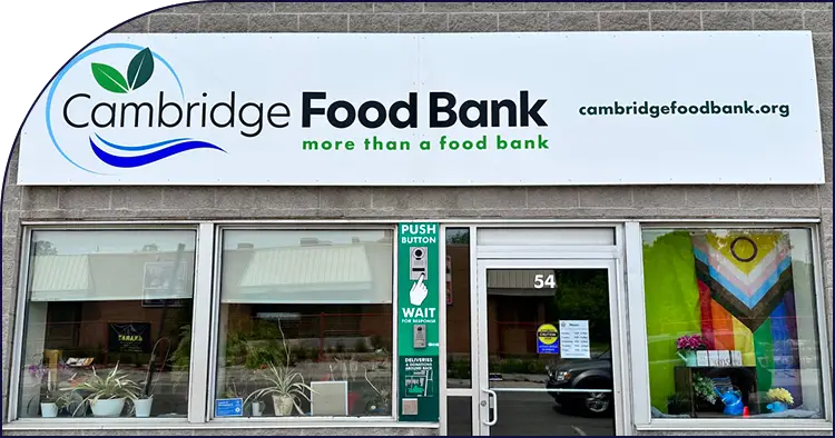 Cambridge Food Bank storefront with logo and entrance door.