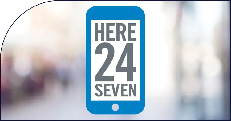 Blue phone icon with "HERE 24 SEVEN" text displayed.